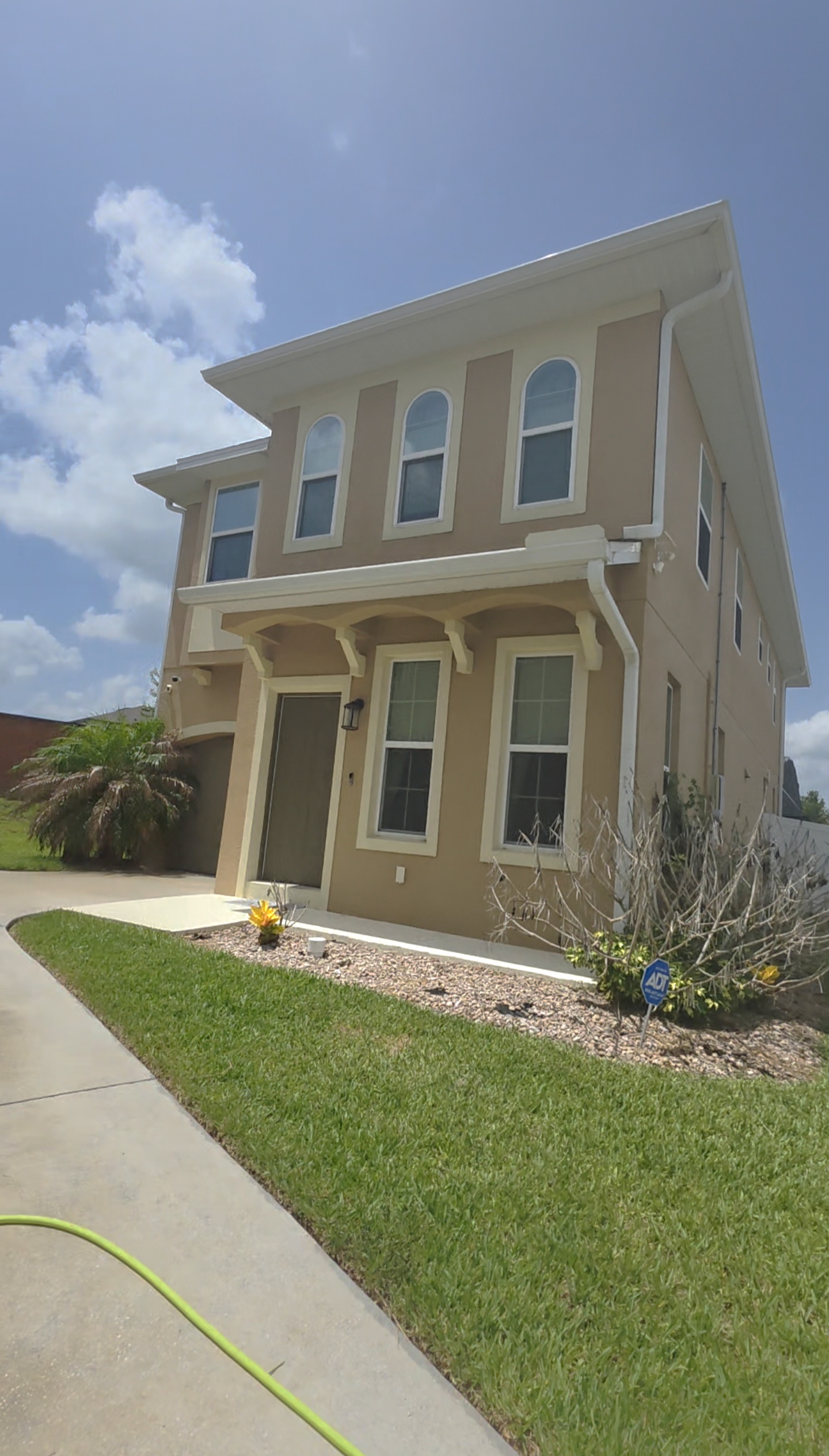 Four Corners Home Gets a Fresh Start: House Washing, Driveway, Fence & Pool Cage Wash
